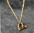 SMITTEN Gold: Dainty Beaded Chain Anchoring an Abstract Heart Shaped Pendant
